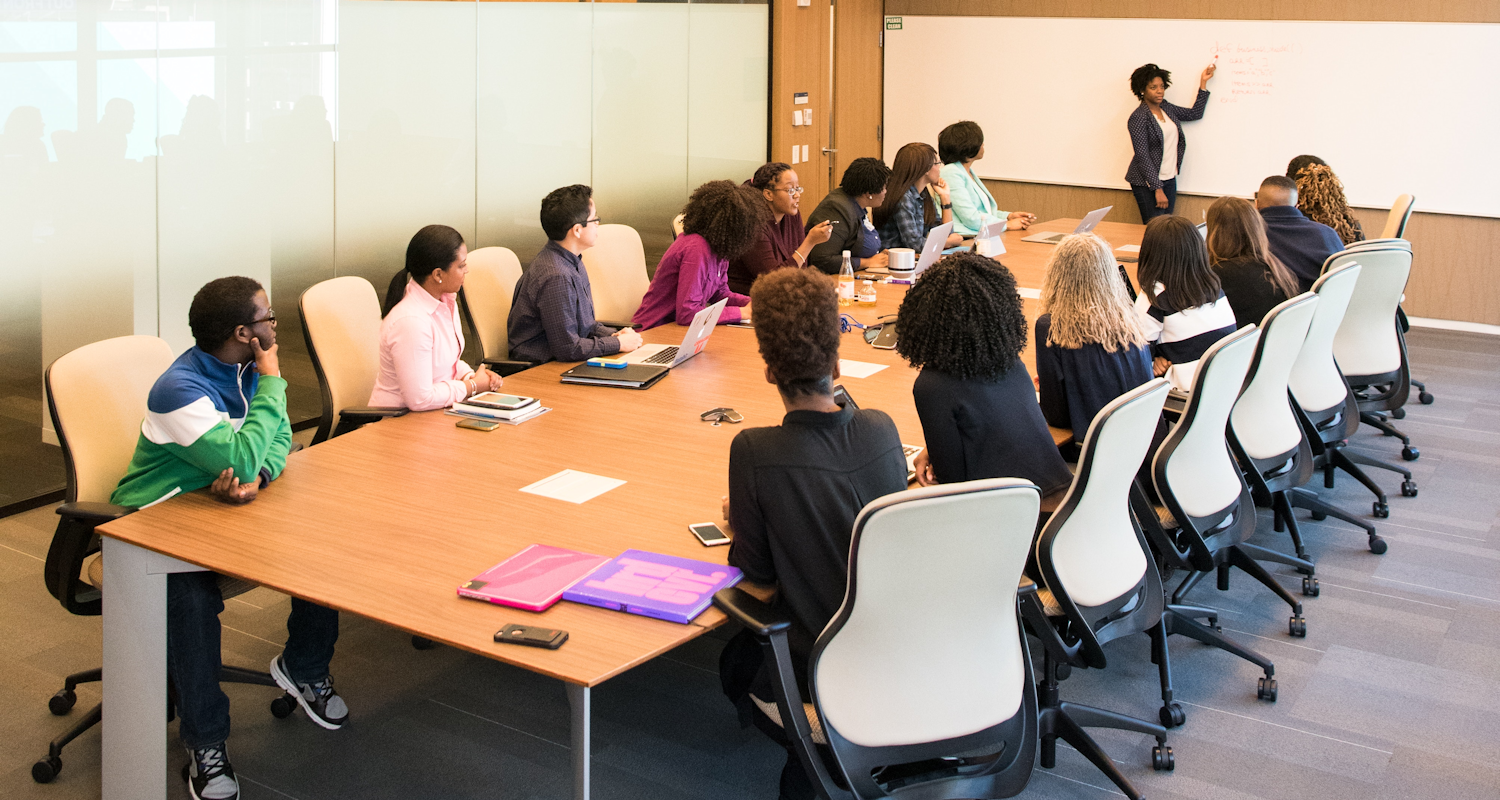 People having meeting inside conference room